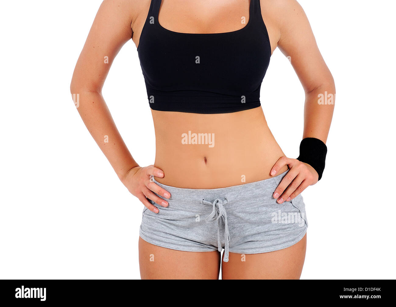 Isolated young fitness woman standing Stock Photo