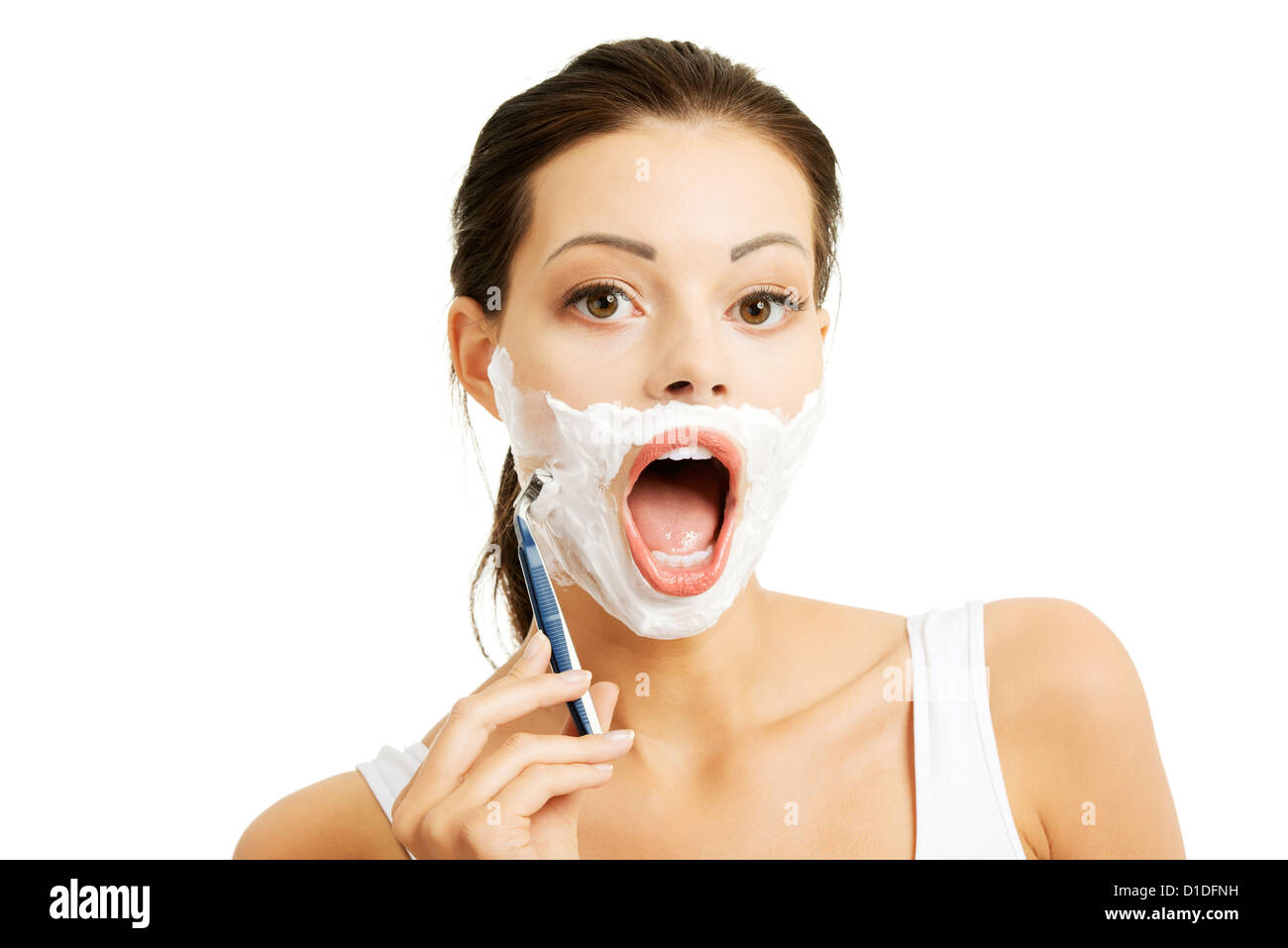 Beautiful young woman shaving her face with a razor Stock Photo Alamy