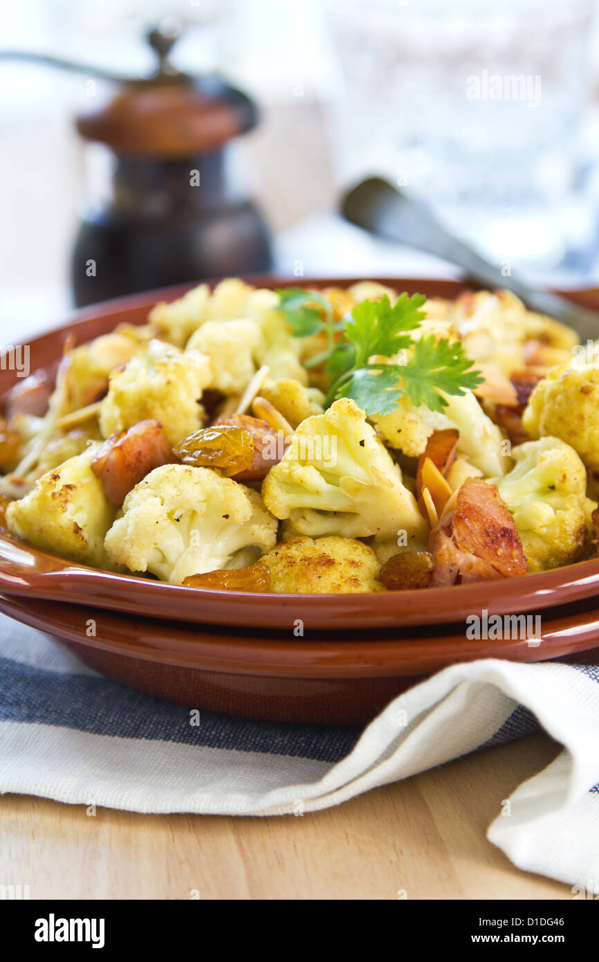 Roasted Cauliflower with Ham,almond and raisin Stock Photo Alamy