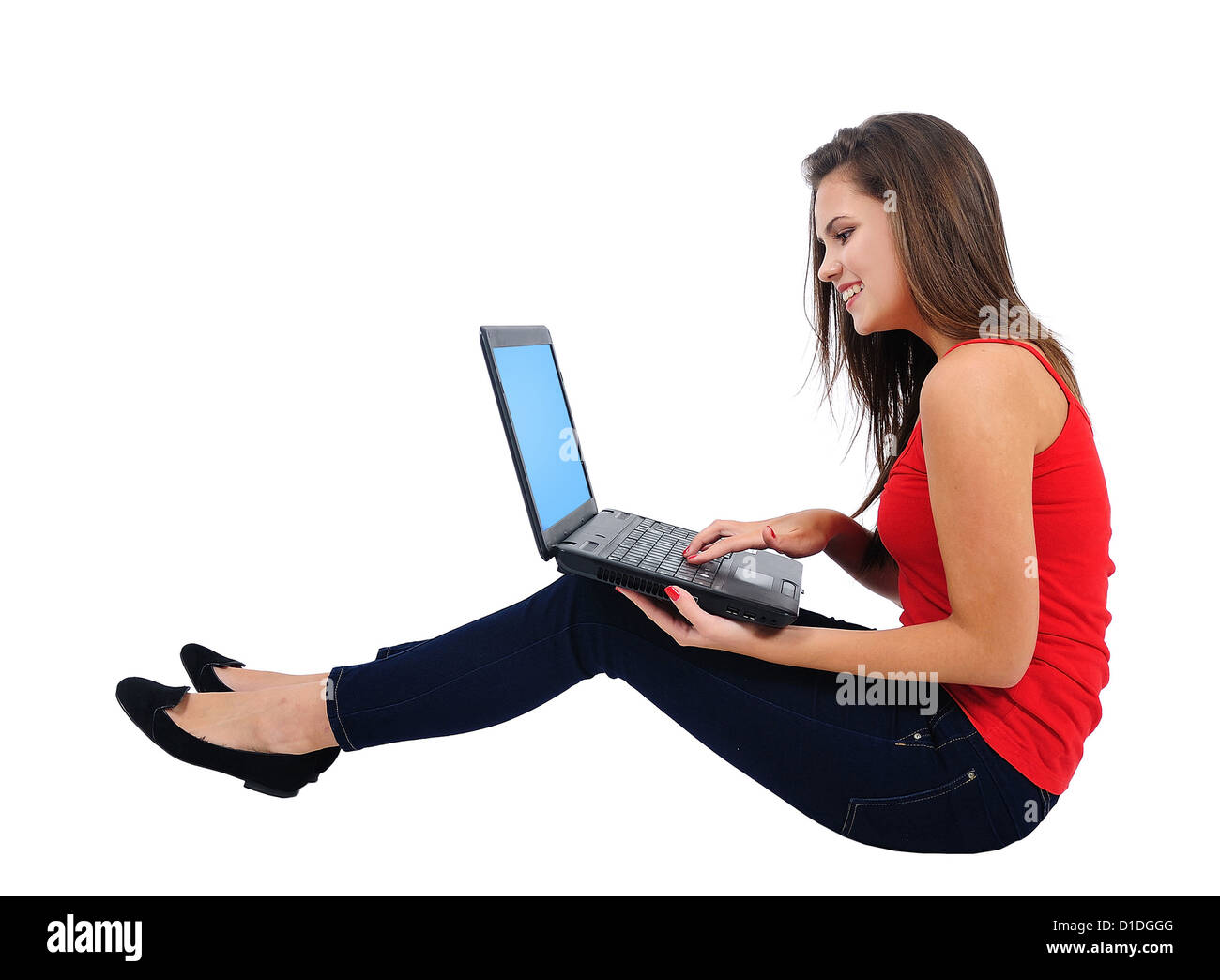 Isolated young casual girl with laptop Stock Photo - Alamy