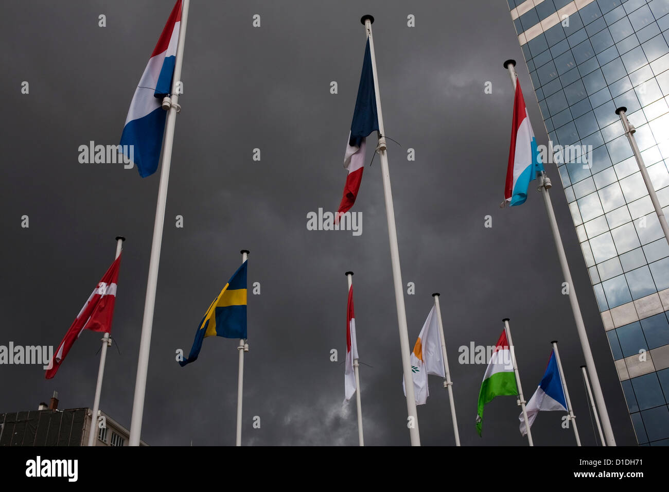 EU flags, stormy weather, Brussels Stock Photo