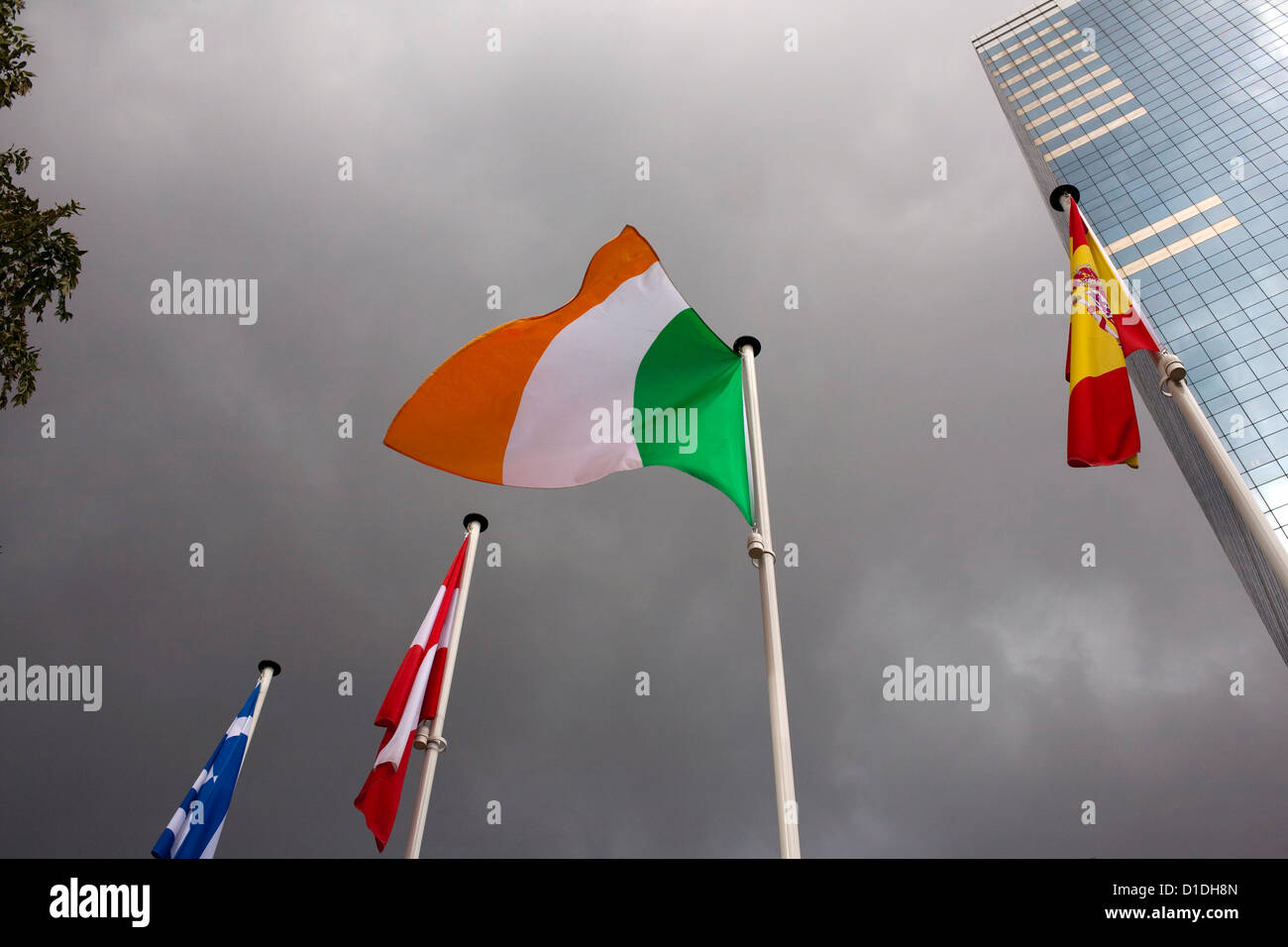 Irish flag flies in stormy weather, Brussels. Stock Photo