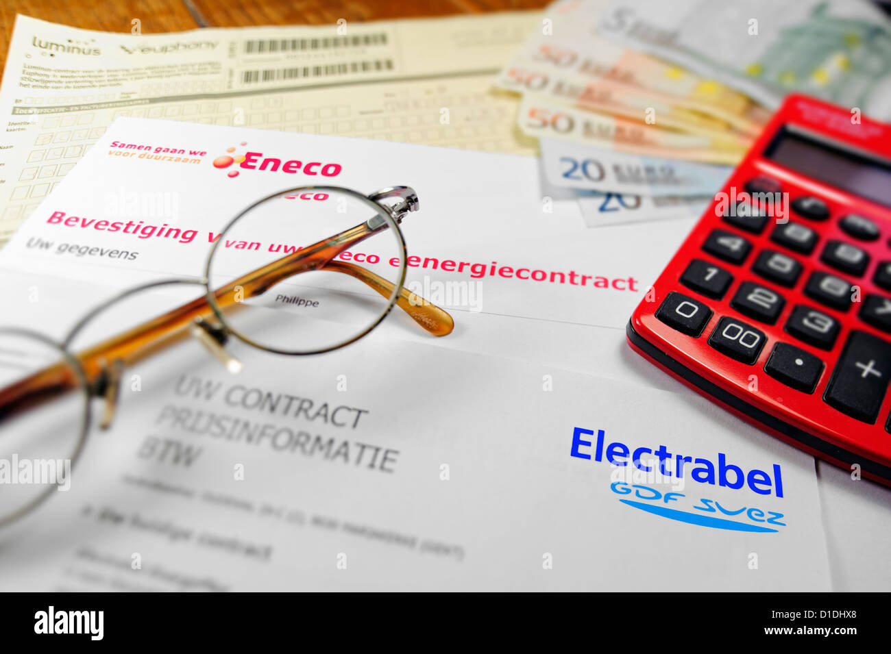 Calculator and Flemish invoices of Eneco and Electrabel, Belgian energy ...