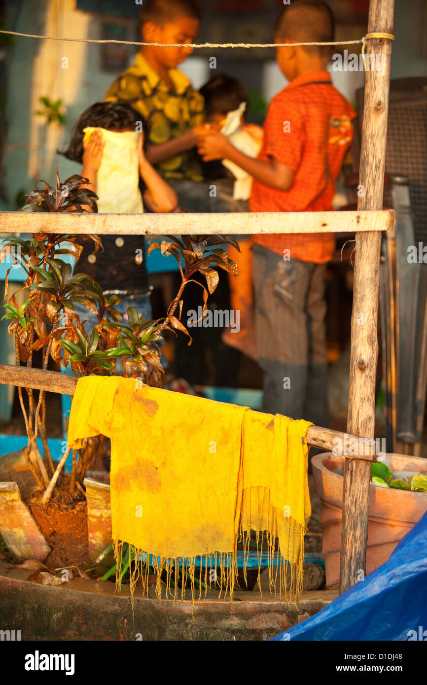 Indian children playing in the sunlight in Varkala, Kerala Stock Photo