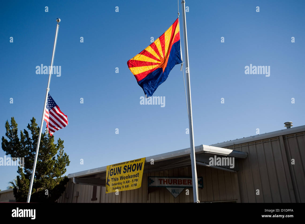 Jan. 14, 2011 - Tucson, Arizona, U.S - As flags fly at half staff as a result of the Jan. 8, 2011 shooting that killed six and wounded 13 including Rep. G.e Giffords, a long-standing gun show is scheduled to open on Jan. 15, 2011 at the Pima County Fairgrounds in Tucson, Ariz. (Credit Image: © Will Seberger/ZUMAPRESS.com) Stock Photo