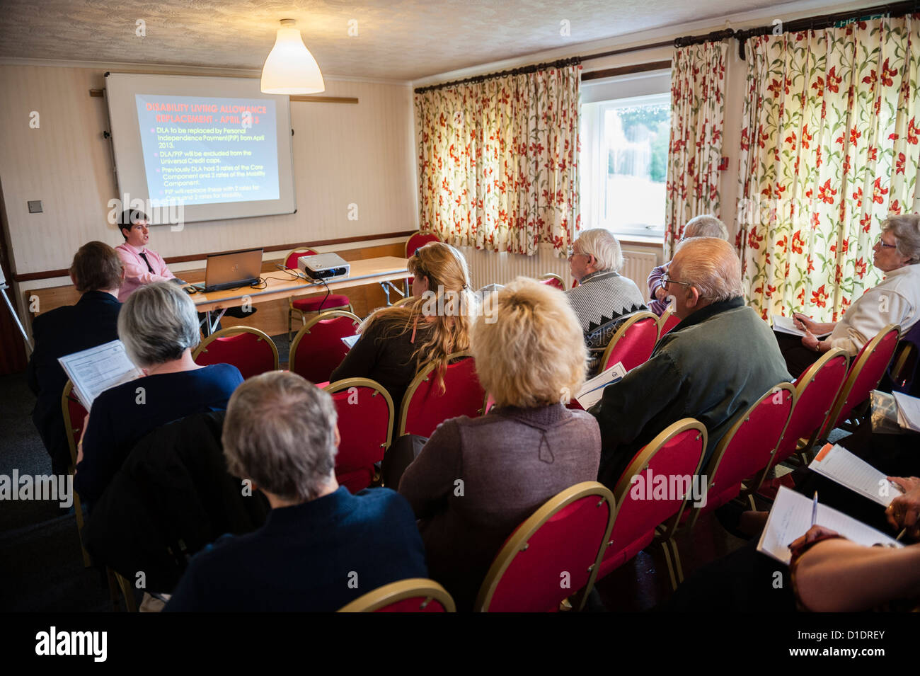 Giving advice on Housing Benefit changes to a members of a housing association at the annual Tenant Conference Stock Photo