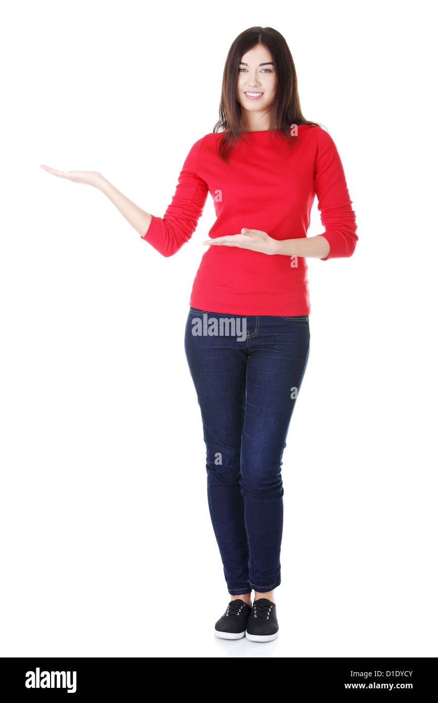 Happy , excited young woman showing copy space, isolated on white Stock ...