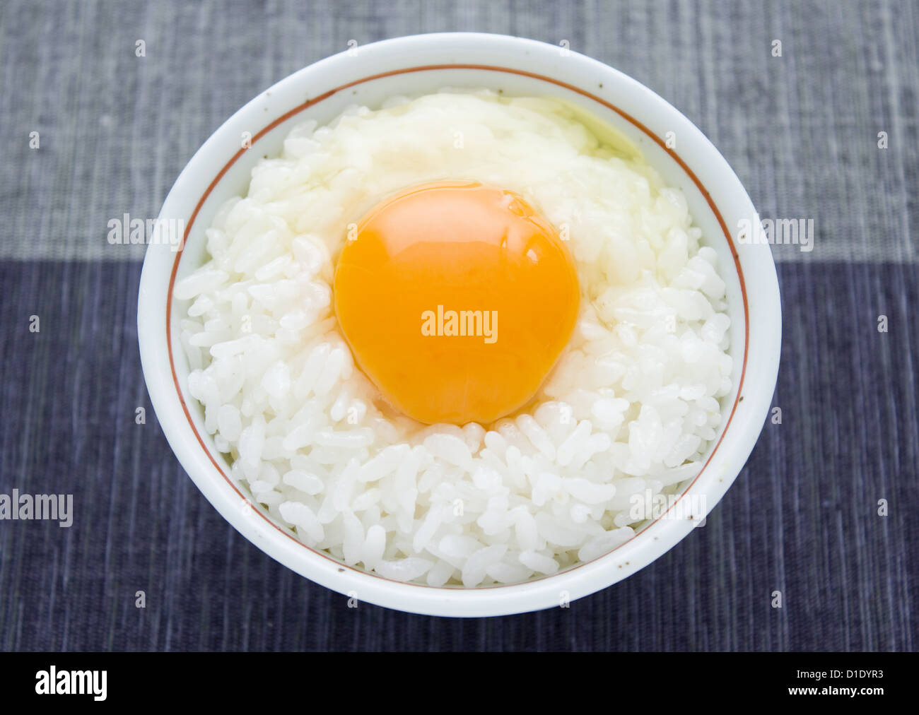 Raw egg sauce over rice Stock Photo Alamy