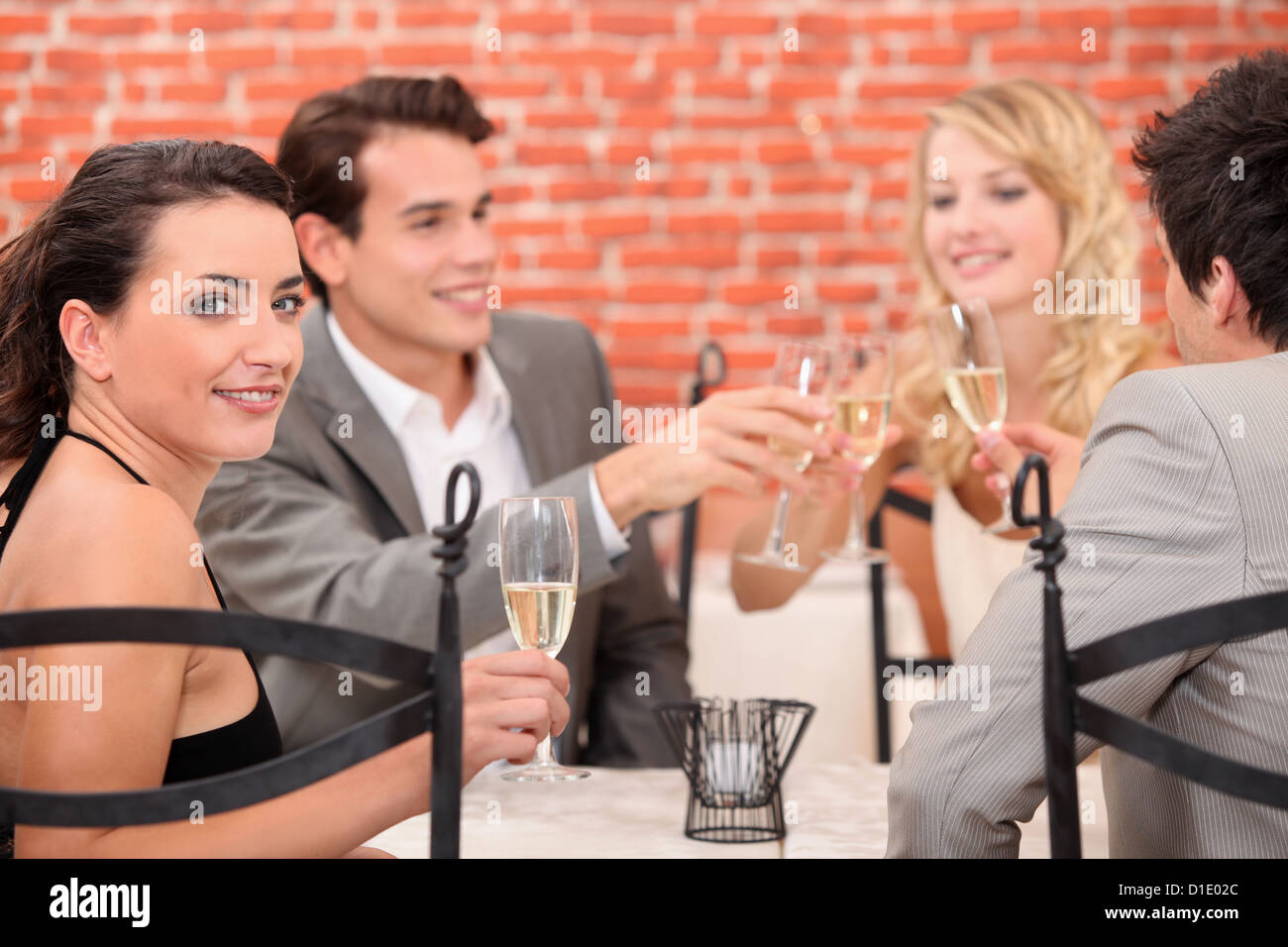 foursome in a restaurant Stock Photo Alamy