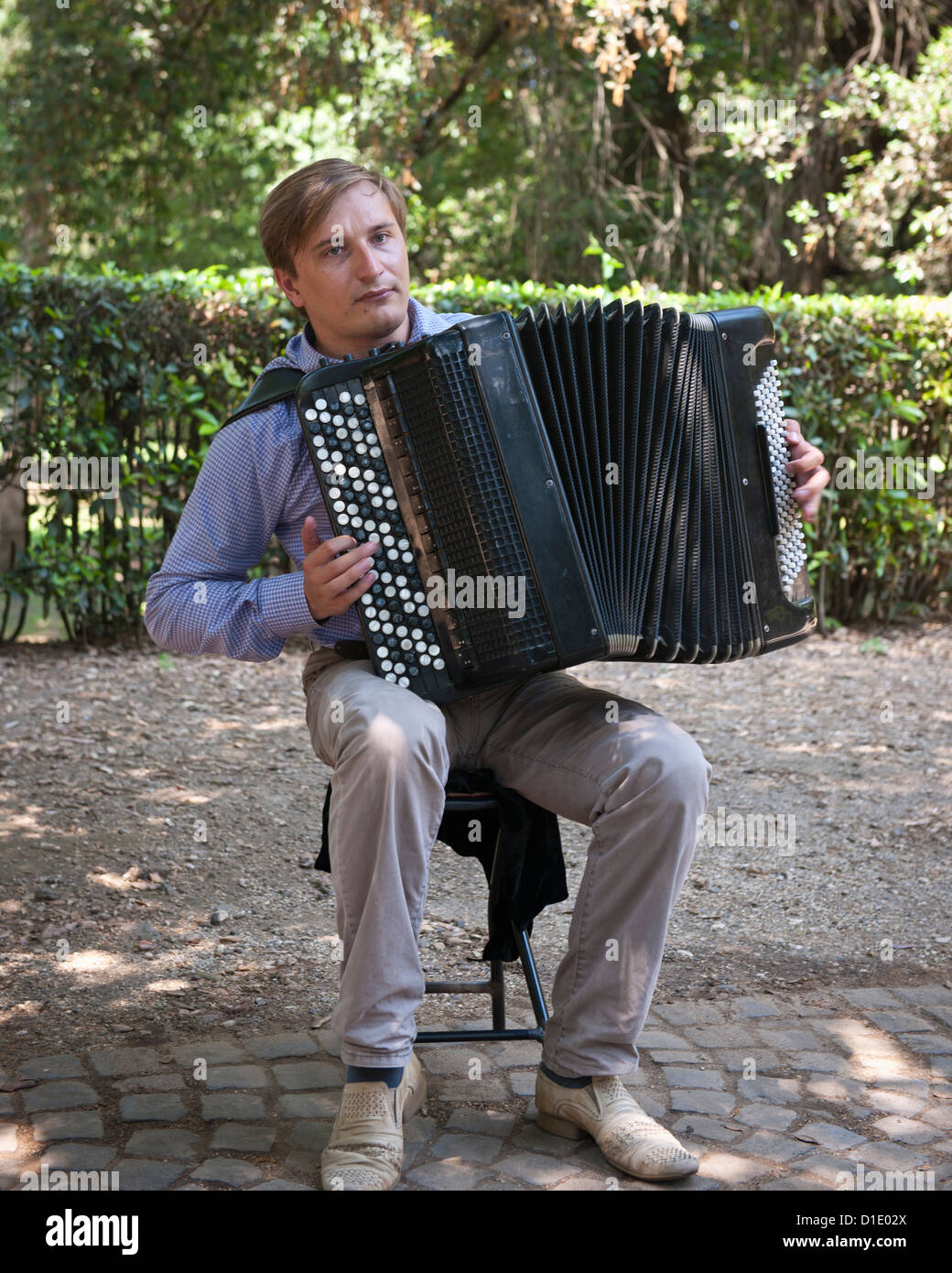 A busker plays accordion, Gardens, Rome Stock Photo Alamy