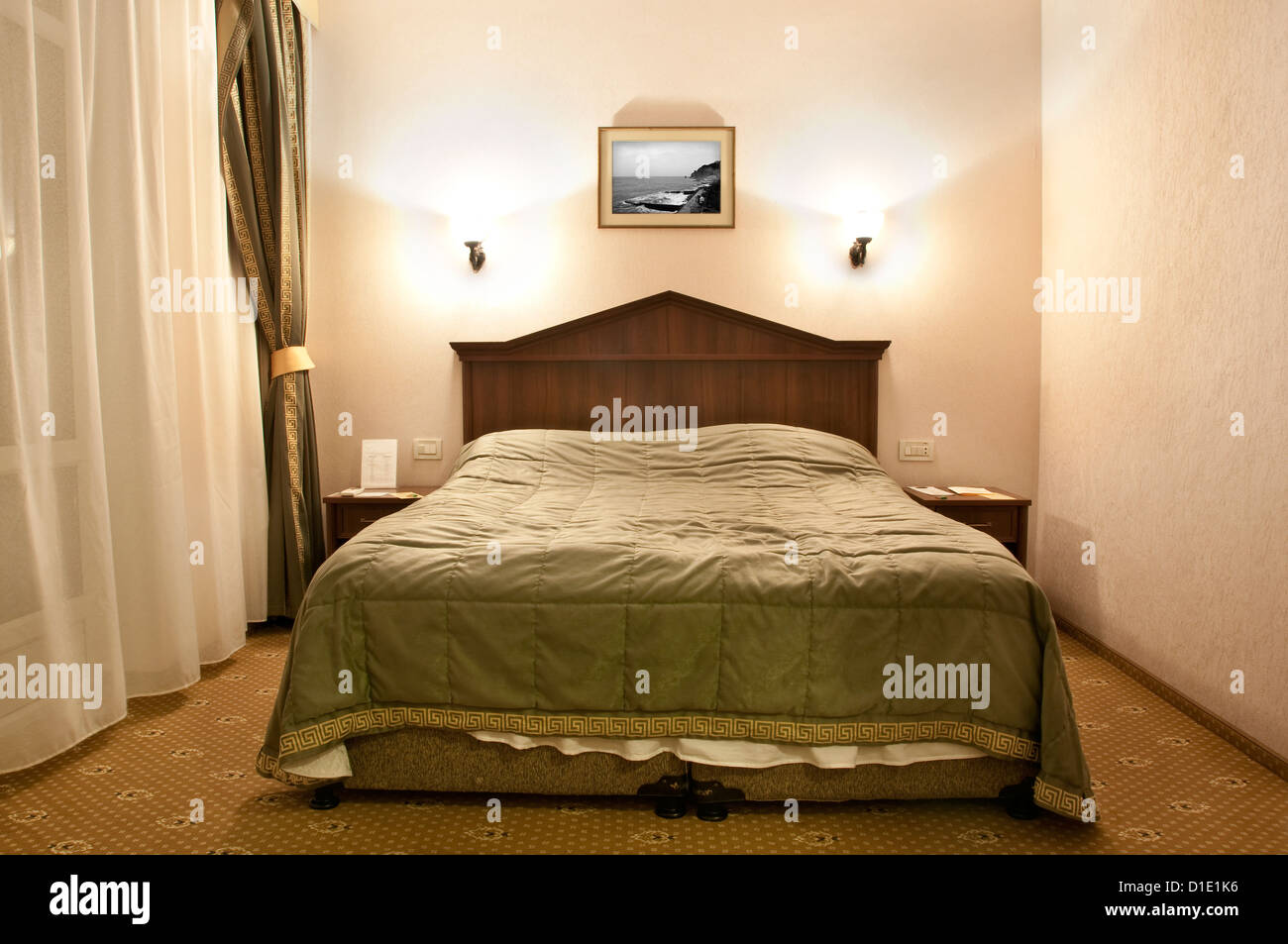 Comfortable double bed in a hotel room Stock Photo Alamy