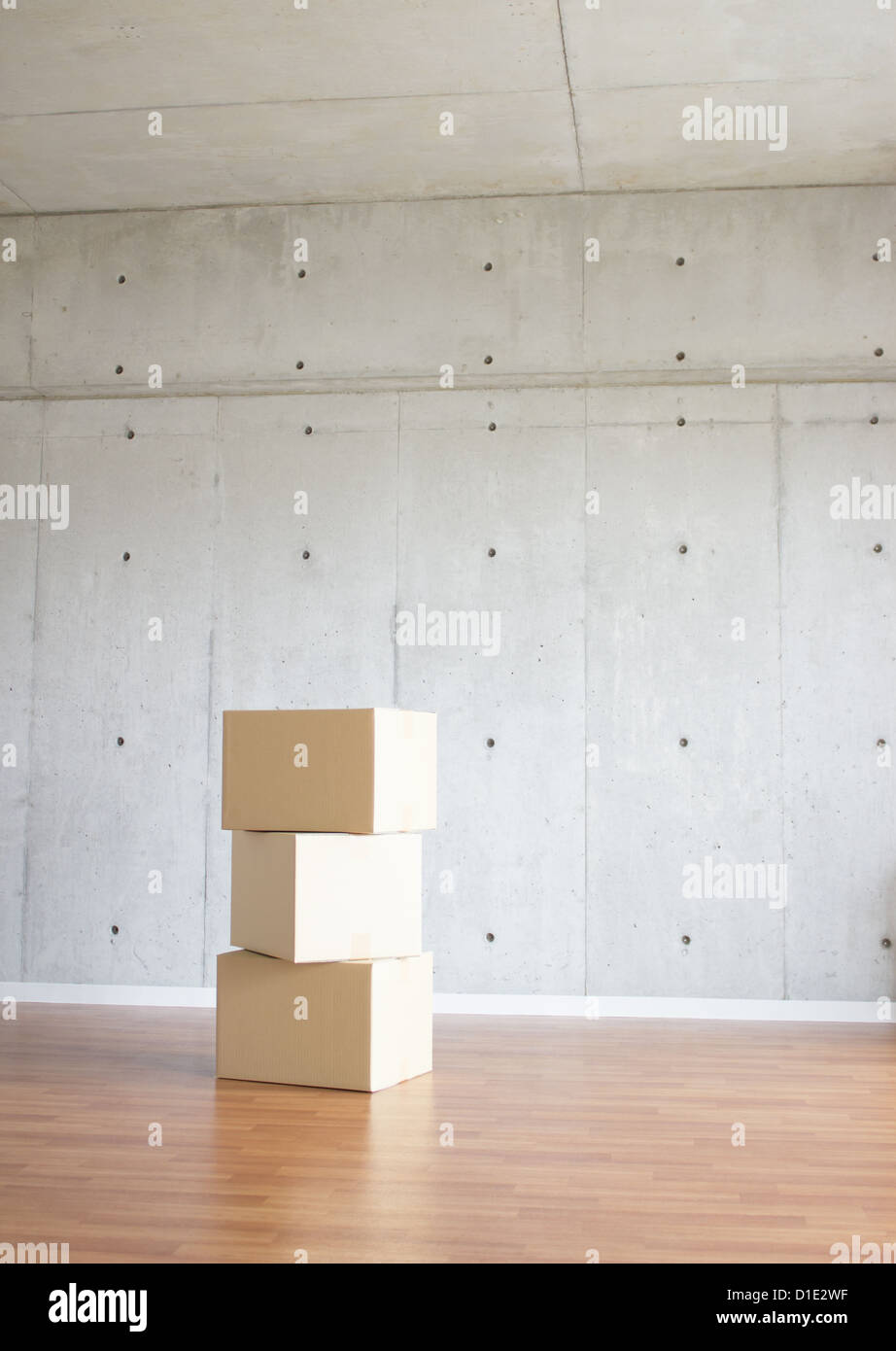 Concrete wall and cardboard boxes Stock Photo Alamy