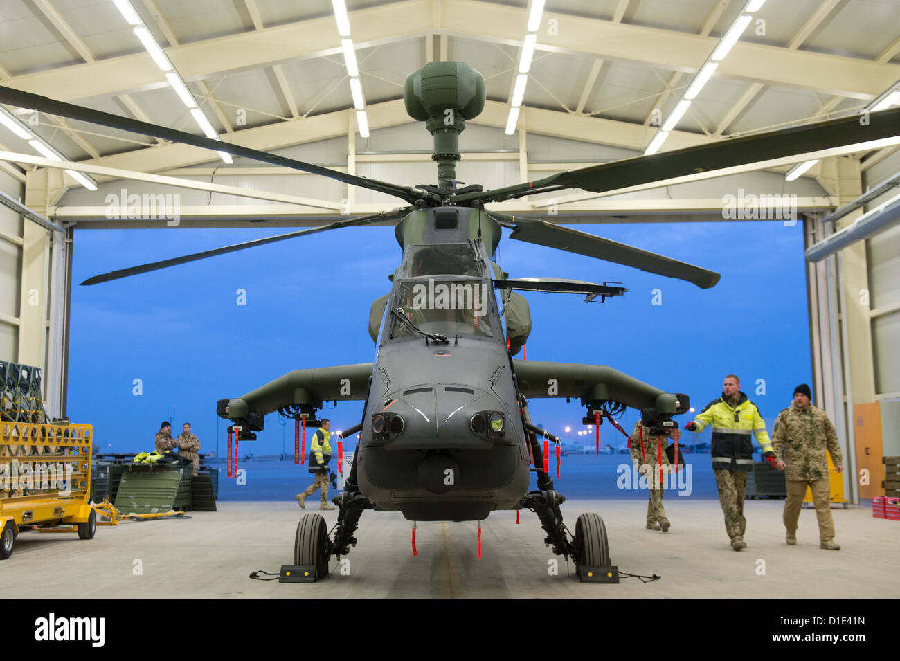 Soldiers of the German Army prepare a Eurocopter Tiger attack helicopter for deployment at the airfield in Mazar-i-Sharif, Afghanistan, 14 December 2012. The attack helicopters are planned to be used for security and surveillance tasks during the two last years of the NATO combat mission in Afghanistan. Photo: Maurizio Gambarini Stock Photo