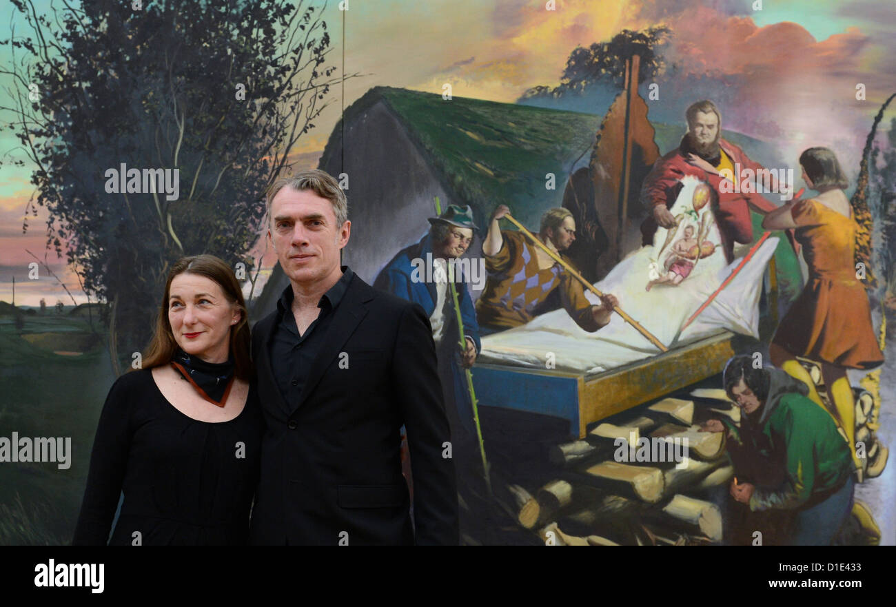 Artist Neo Rauch from Leipzig and his wife Rosa Loy stand in front of Rauch's painting 'Der boese Kranke' (2012) at the Art collection Chemnitz in Chemnitz, Germany, 14 December 2012. It is their first corporate exhibition with 23 art works. Photo: Hendrik Schmidt Stock Photo