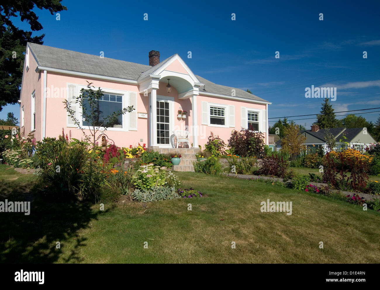 Exterior view of a one story peach colored house at Bellingham; Washington; USA Stock Photo