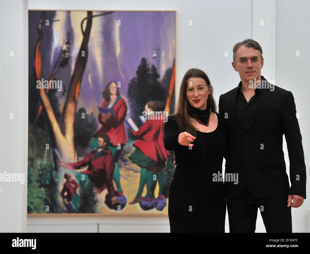 Artist Neo Rauch from Leipzig and his wife Rosa Loy stand in front of Rauch's painting 'Chor' (2011) at the Art collection Chemnitz in Chemnitz, Germany, 14 December 2012. It is their first corporate exhibition with 23 art works. Photo: Hendrik Schmidt Stock Photo