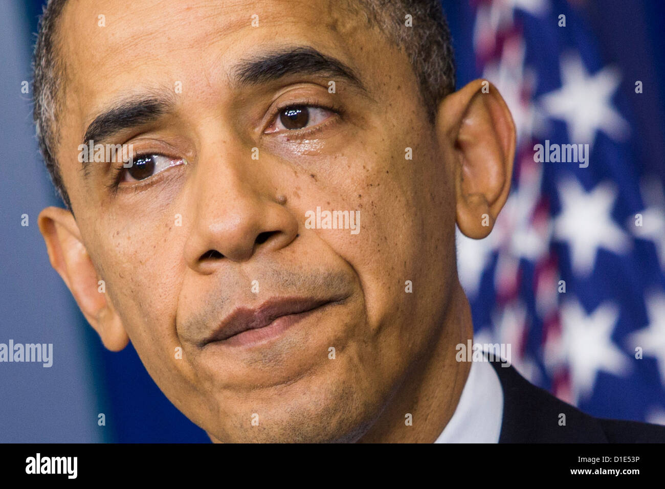 United States President Barack Obama eyes are wet with tears as he delivers remarks in the Brady Press Briefing Room of the White House in Washington, D.C. in response to the school shooting at Sandy Hook Elementary School in Newtown, Connecticut that left 28 students and adults dead on Friday, December 14, 2012. .Credit: Kristoffer Tripplaar / Pool via CNP Stock Photo