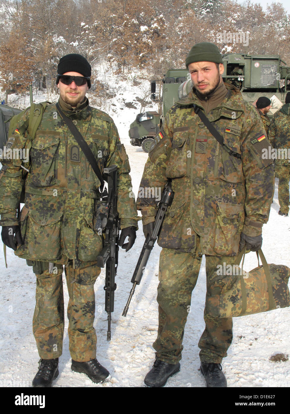 Bundeswehr soldiers wear uniform and weapons on duty at the Zupce post in Mitrovica, Kosovo, 14 December 2012. Photo: Thomas Brey Stock Photo