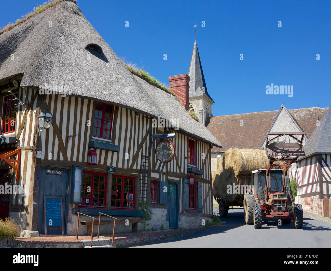 Auberge des Deux Tonneaux (Two Barrels Inn), with tractor, Pierrefitte en Auge, Calvados, Normandy, France Stock Photo