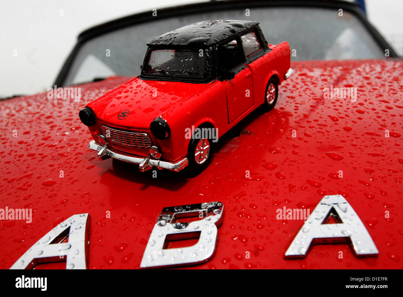 Red Trabant car model on the hood of the vehicle Stock Photo