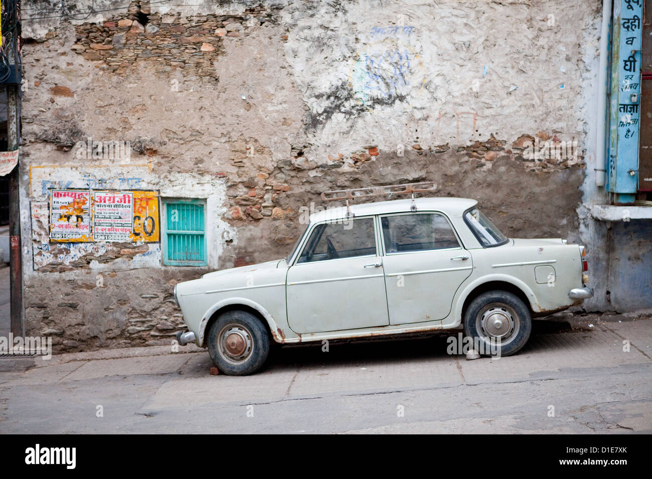 White car on the streets of Udaipur Stock Photo