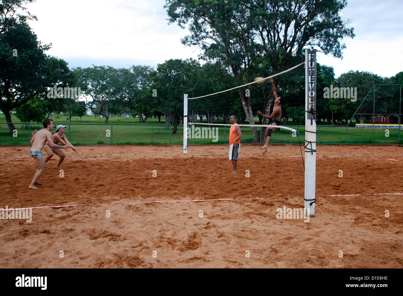 Men playing volleyball at Parque Cidade Sarah Kubitschek, Brasilia, Brazil, South America Stock Photo