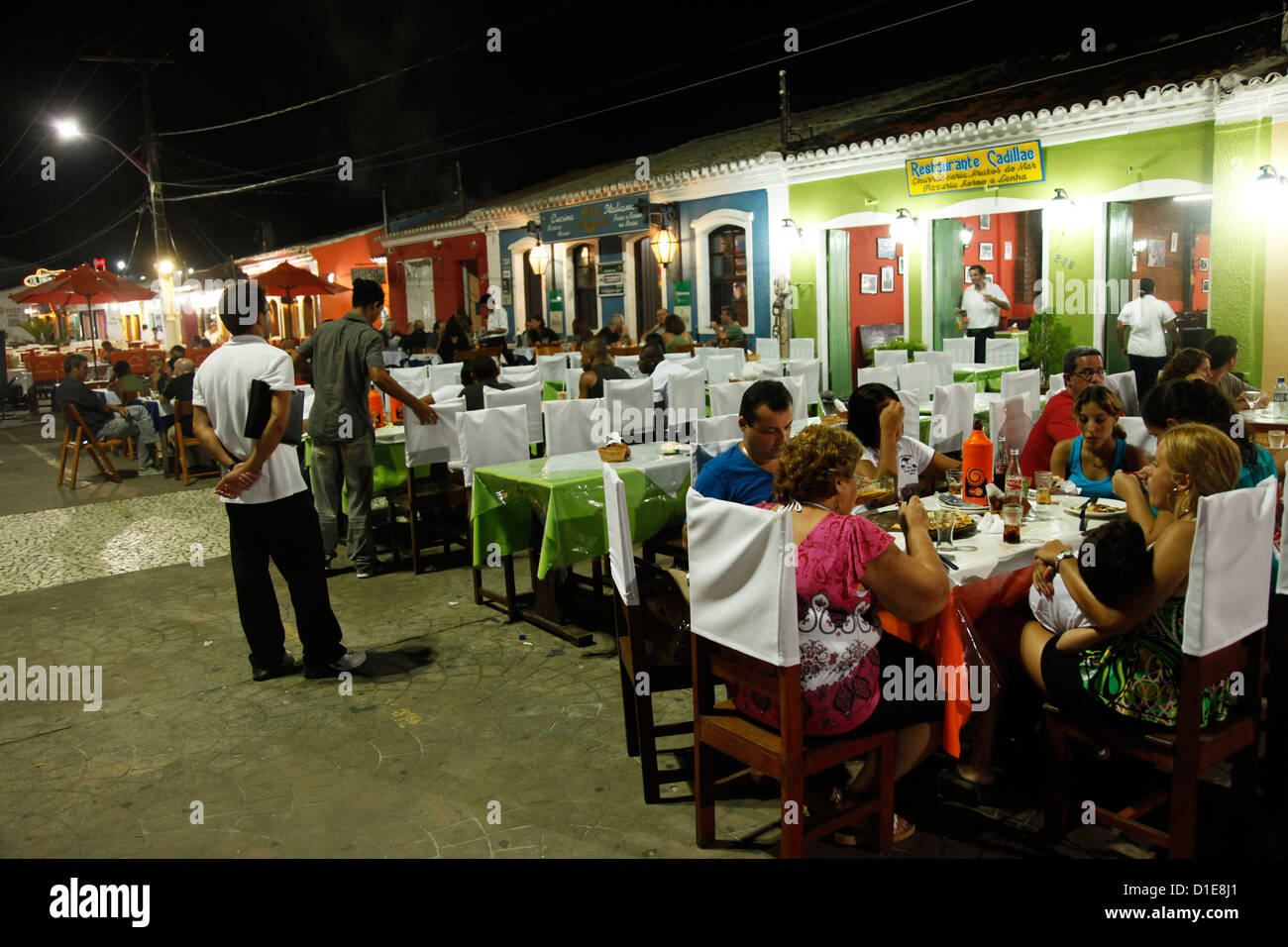 People sitting at outdoor restaurants in Porto Seguro, Bahia, Brazil, South America Stock Photo