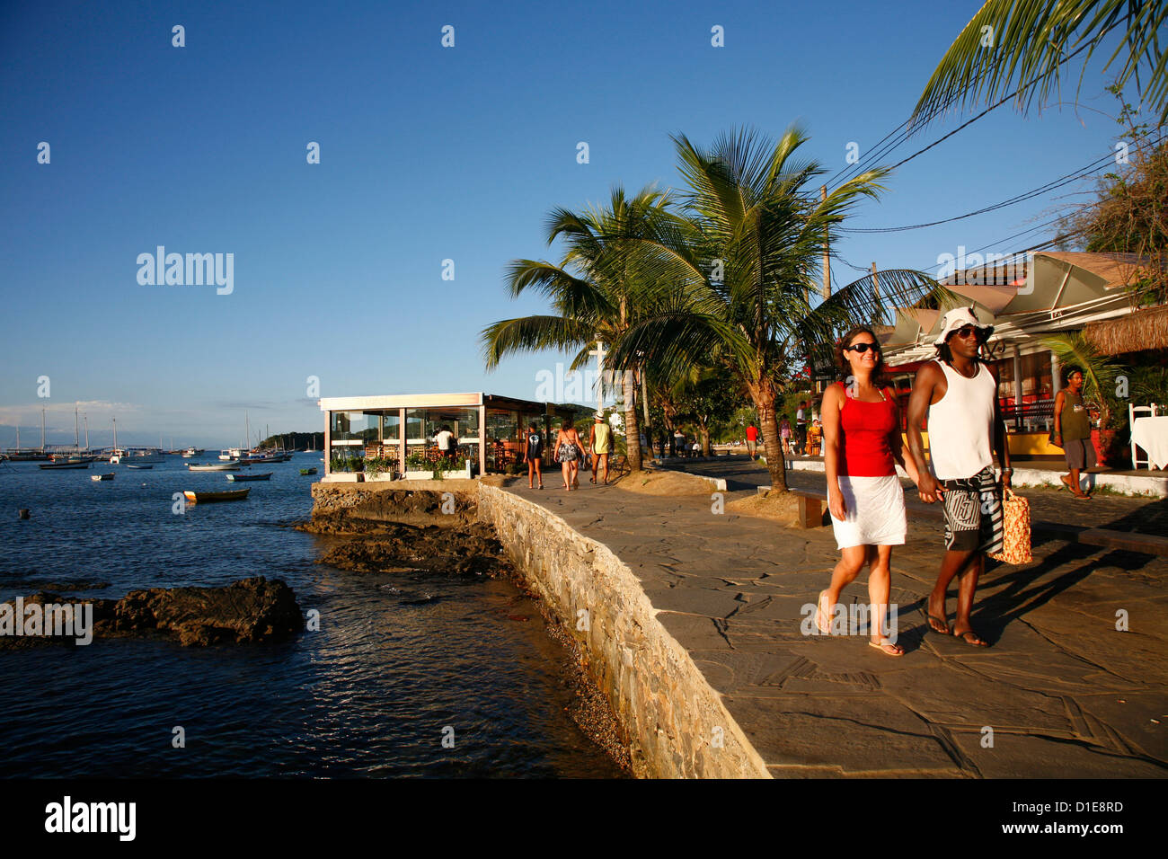 People walking on Orla Bardot promenade, Buzios, Rio de Janeiro State, Brazil, South America Stock Photo