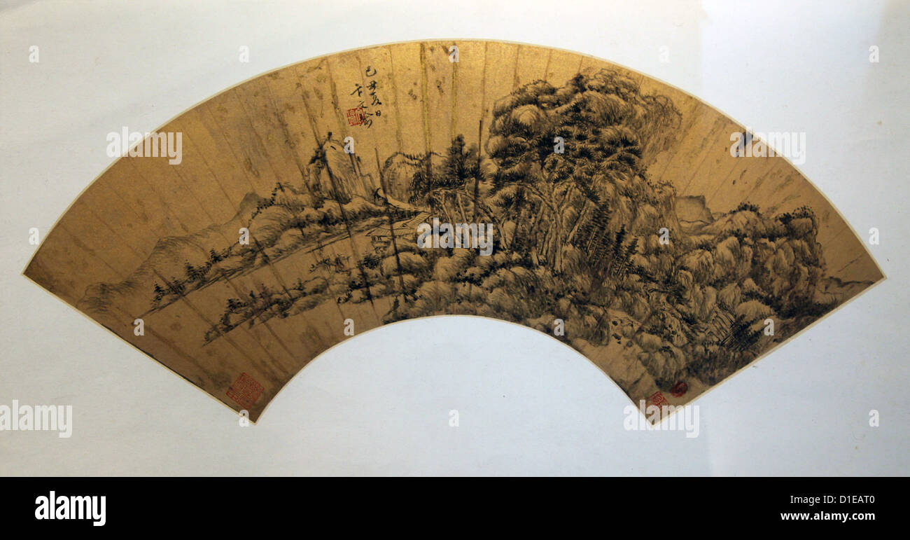 It's a photo of a open Chinese Folding hand fan which is in a museum in china. We can see a drawing bamboo with black ink on it Stock Photo
