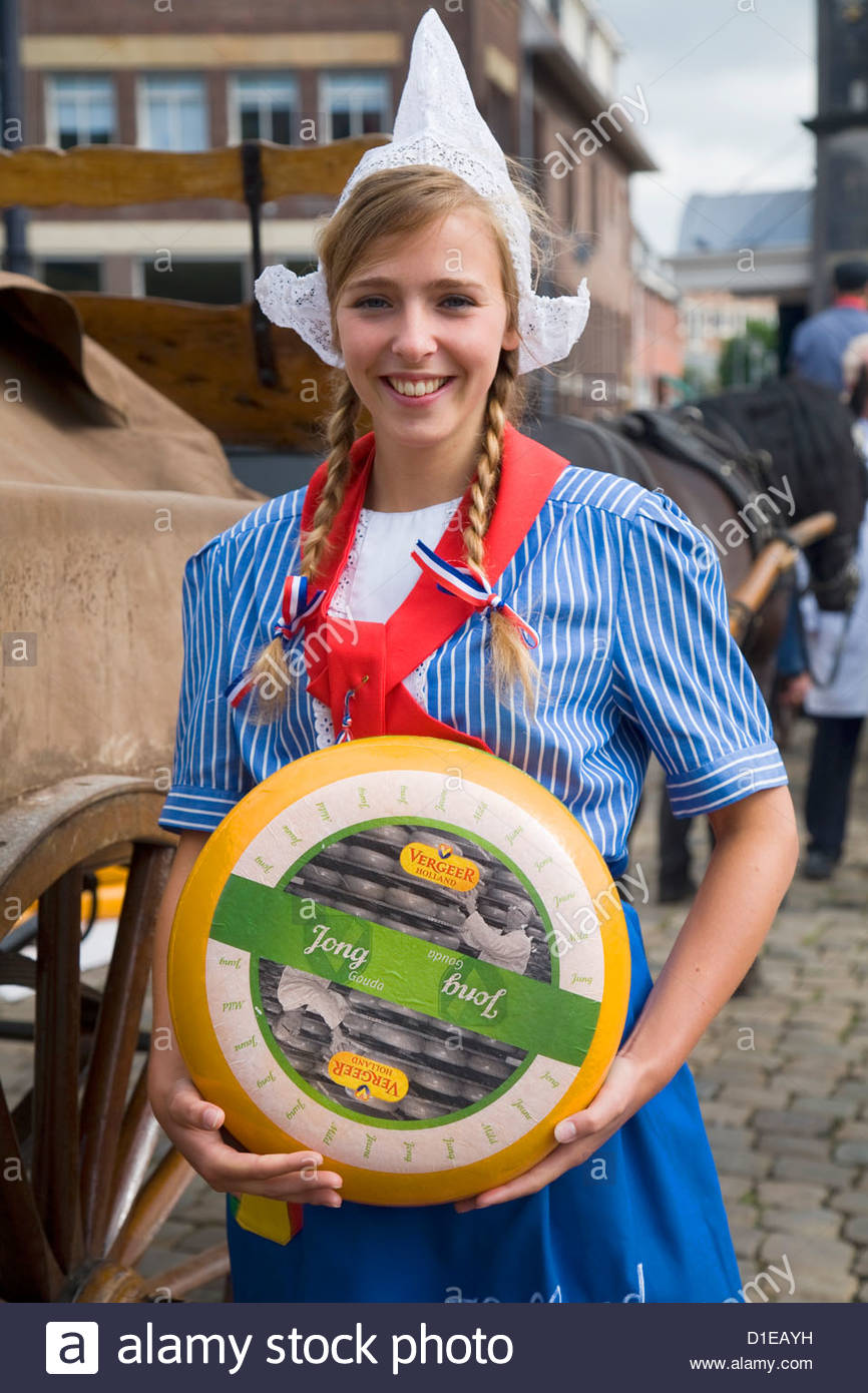 Pretty young woman in Dutch national costume at Gouda cheese market ...