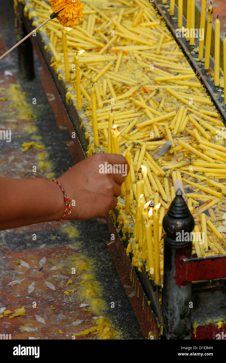 Lighting a candle in Doi Suthep, Chiang Mai, Thailand, Southeast Asia, Asia Stock Photo