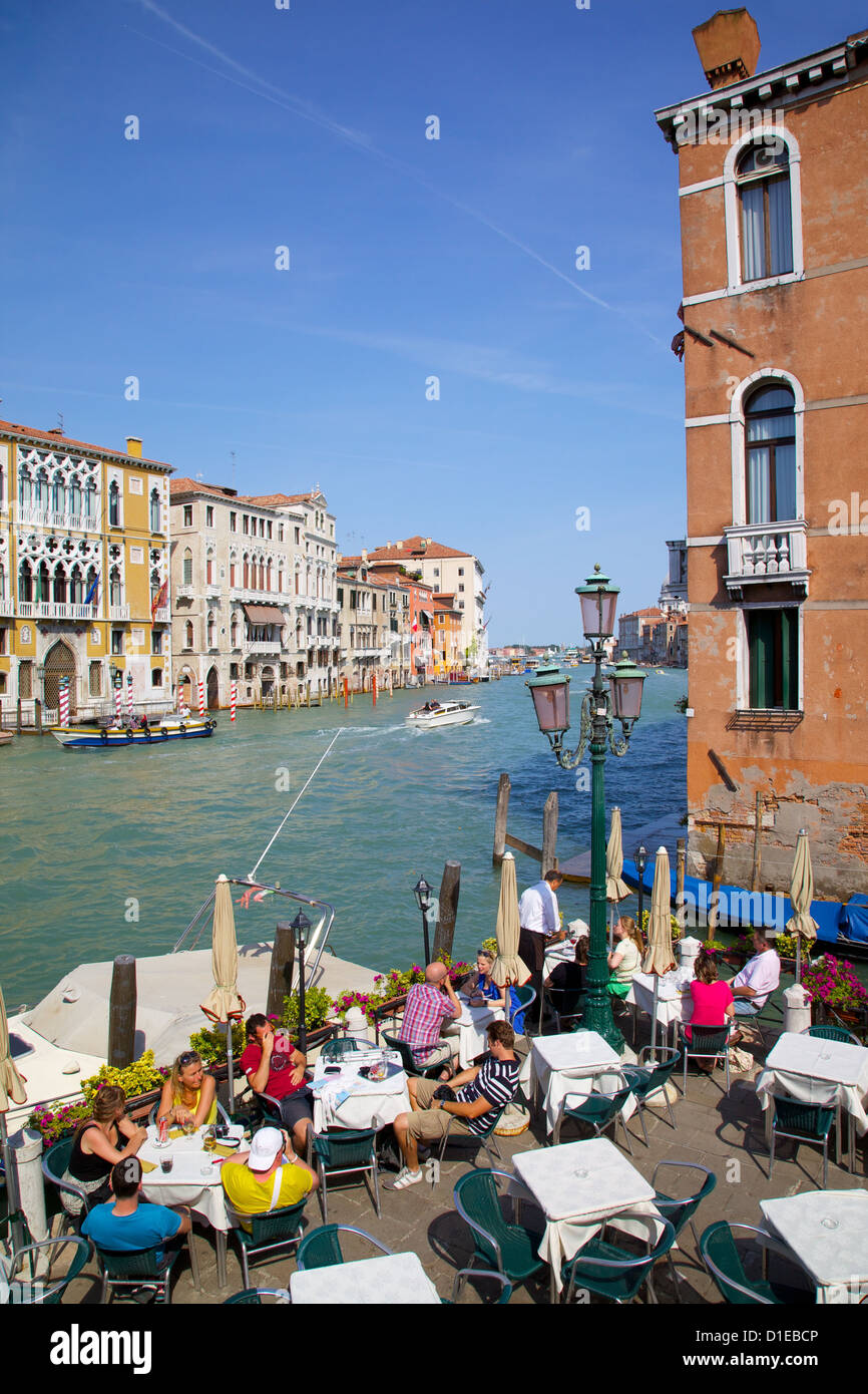 Canalside cafe and Grand Canal, Dorsoduro, Venice, UNESCO World Heritage Site, Veneto, Italy, Europe Stock Photo