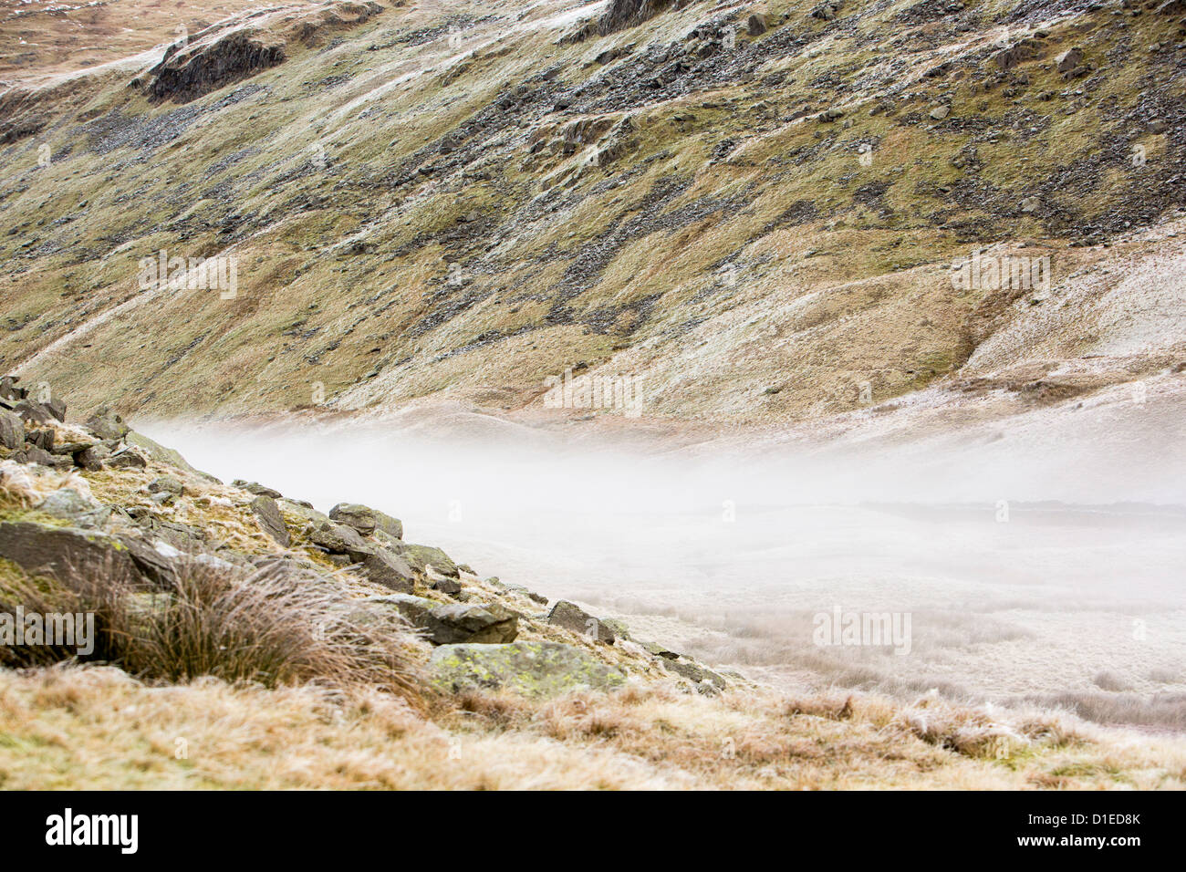 The Kirkstone Pass road above Ambleside with mist from a temperature inversion, Lake District, UK. Stock Photo