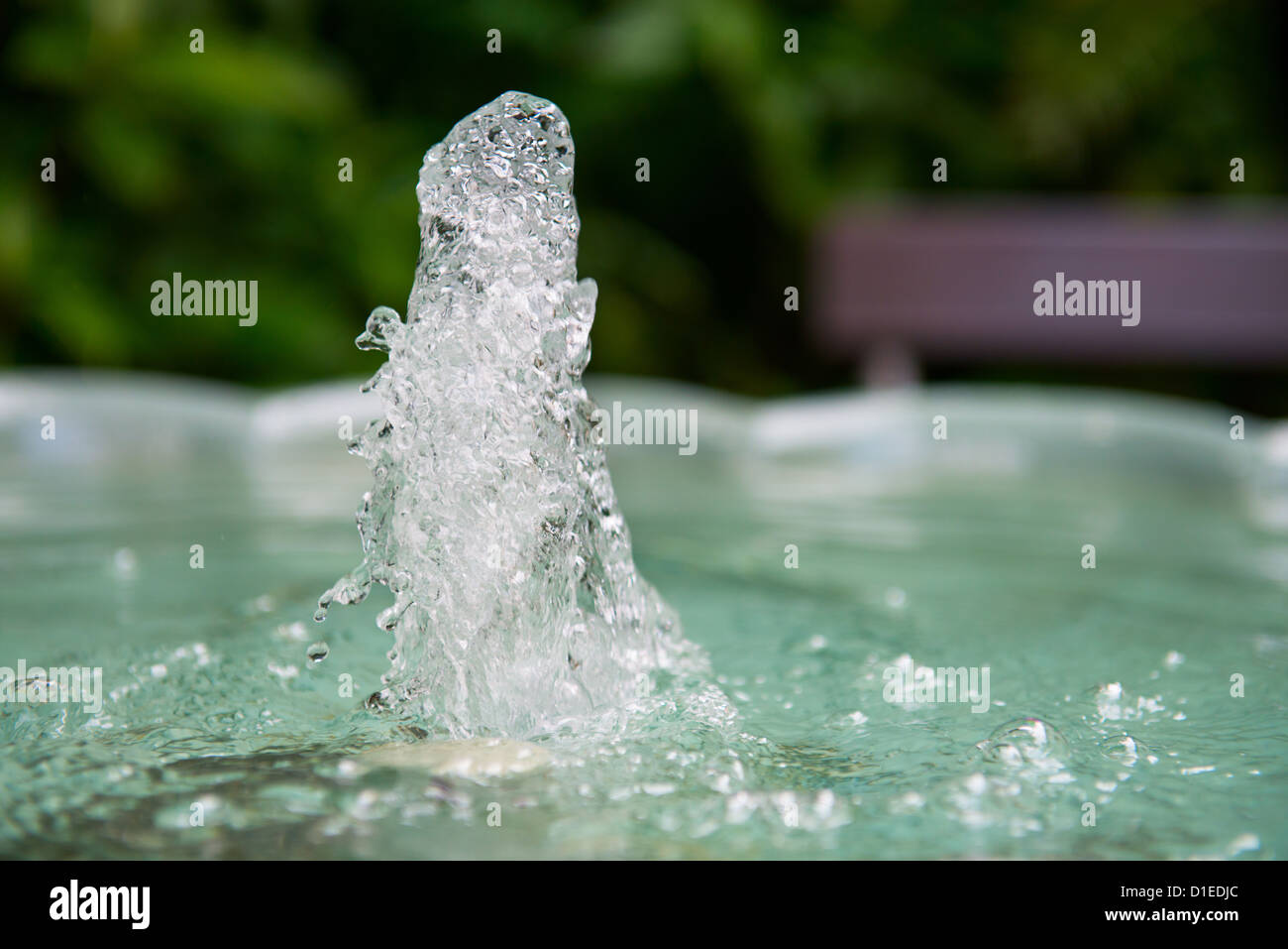 Spray of water in the fountain in a park Stock Photo Alamy