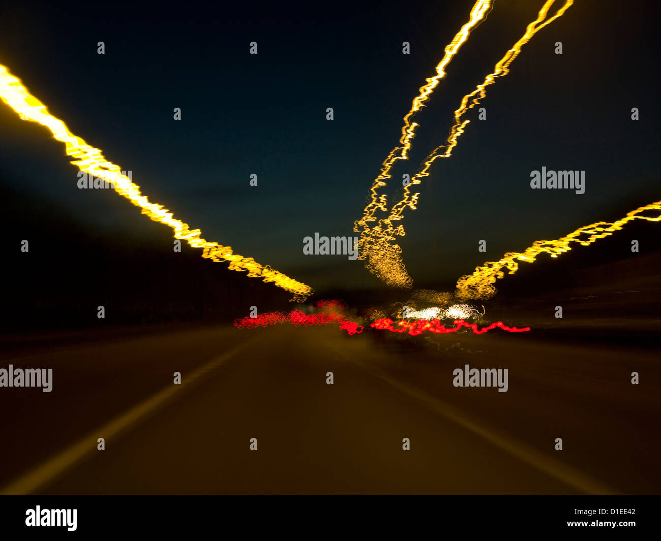 Motorway at night with streaming traffic lights Stock Photo Alamy