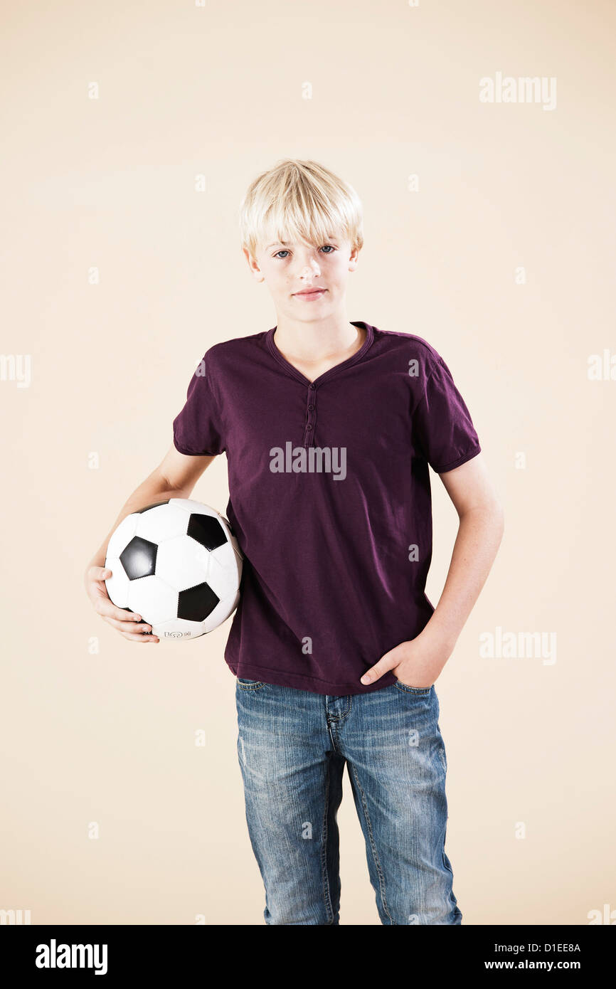 Blond boy with a football Stock Photo