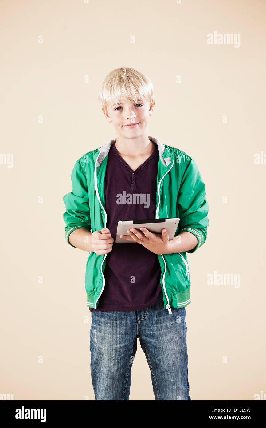 Blond boy with ipad Stock Photo
