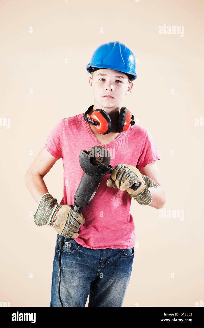 Teenage boy with hard helm and protective gloves Stock Photo