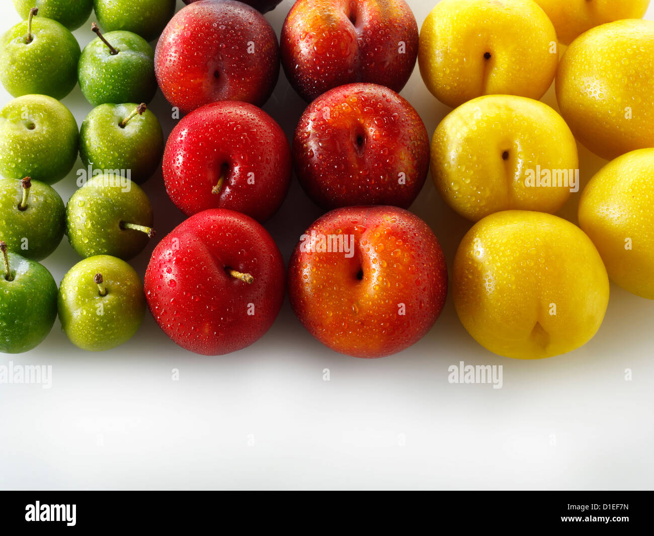 Mixed red, yellow and green plums Stock Photo