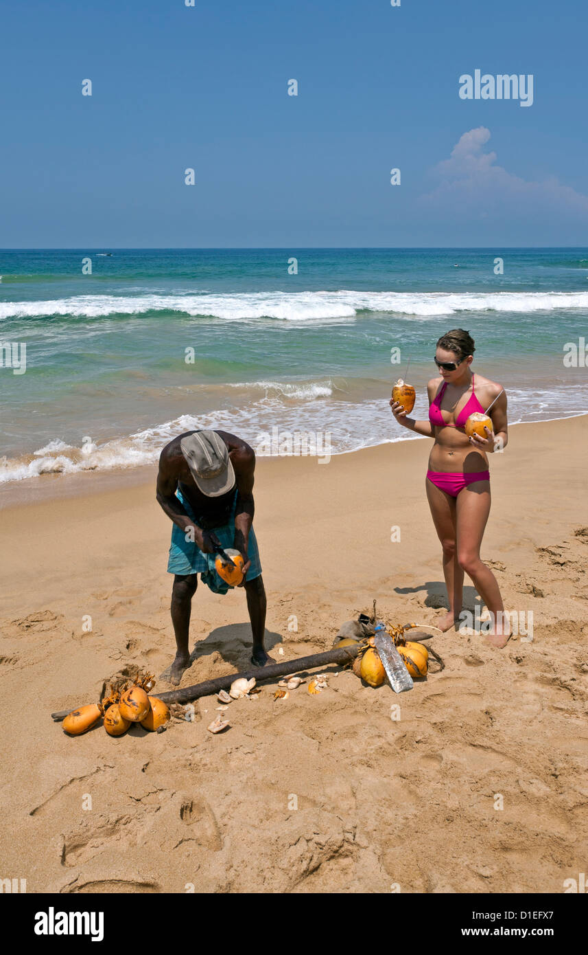 Coconut´s seller. Hikkaduwa beach. Sri Lanka Stock Photo