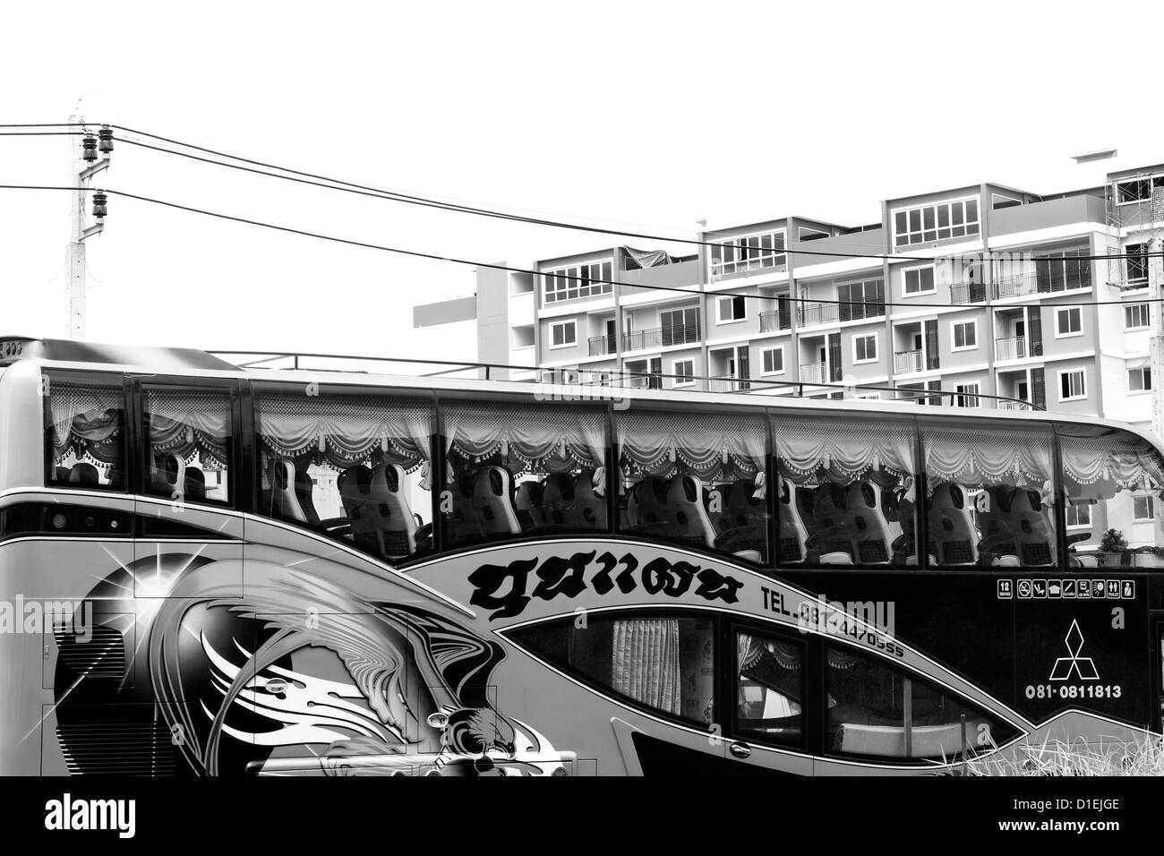 Tour bus with a graphic murallike design on the side Stock Photo Alamy