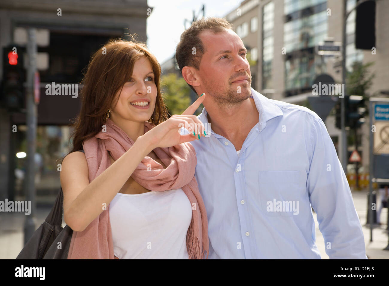 Smiling young couple outdoors Stock Photo - Alamy