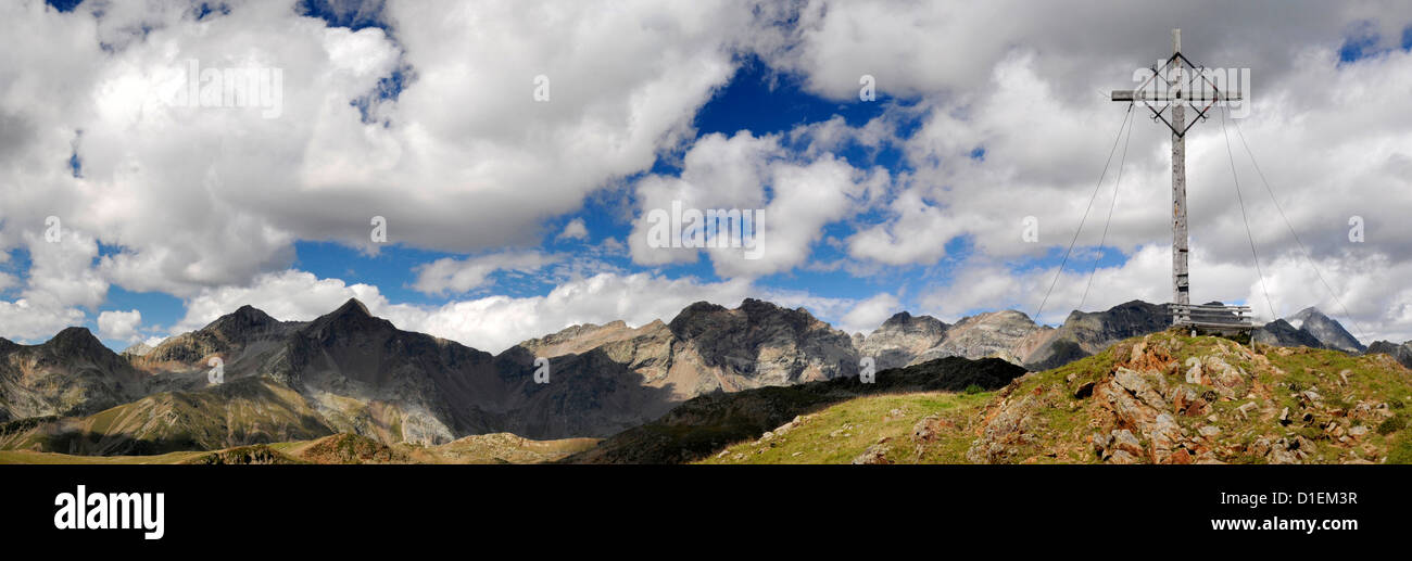 Mountainscape with summit cross in the Rieserferner-Ahrn Nature Park, Zillertal Alps, South Tyrol, Italy Stock Photo