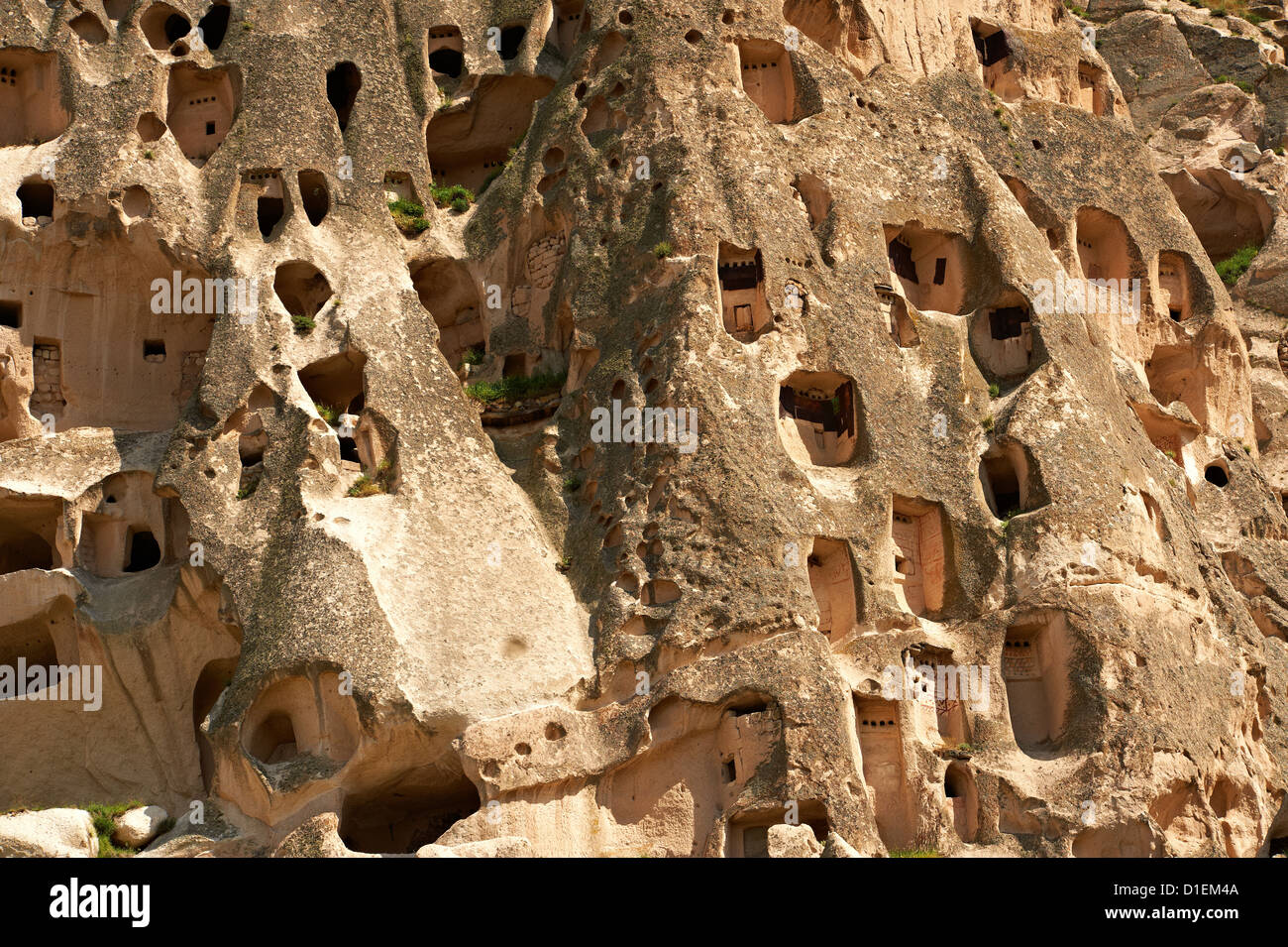 Rock houses of Uchisar, Cappadocia Turkey. Volcanic tuft rock formations Stock Photo