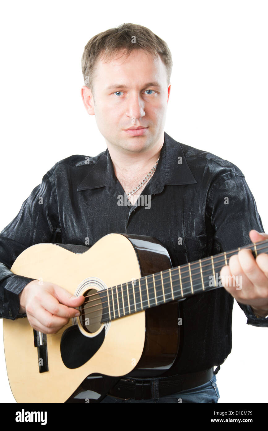 Musical instrument. Guitarist playing acoustic sixstring guitar