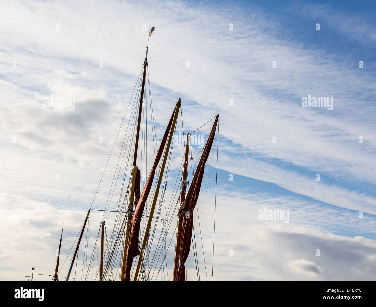 Thames sailing ship or barge with masts and sails by dock in Faversham Kent UK Stock Photo