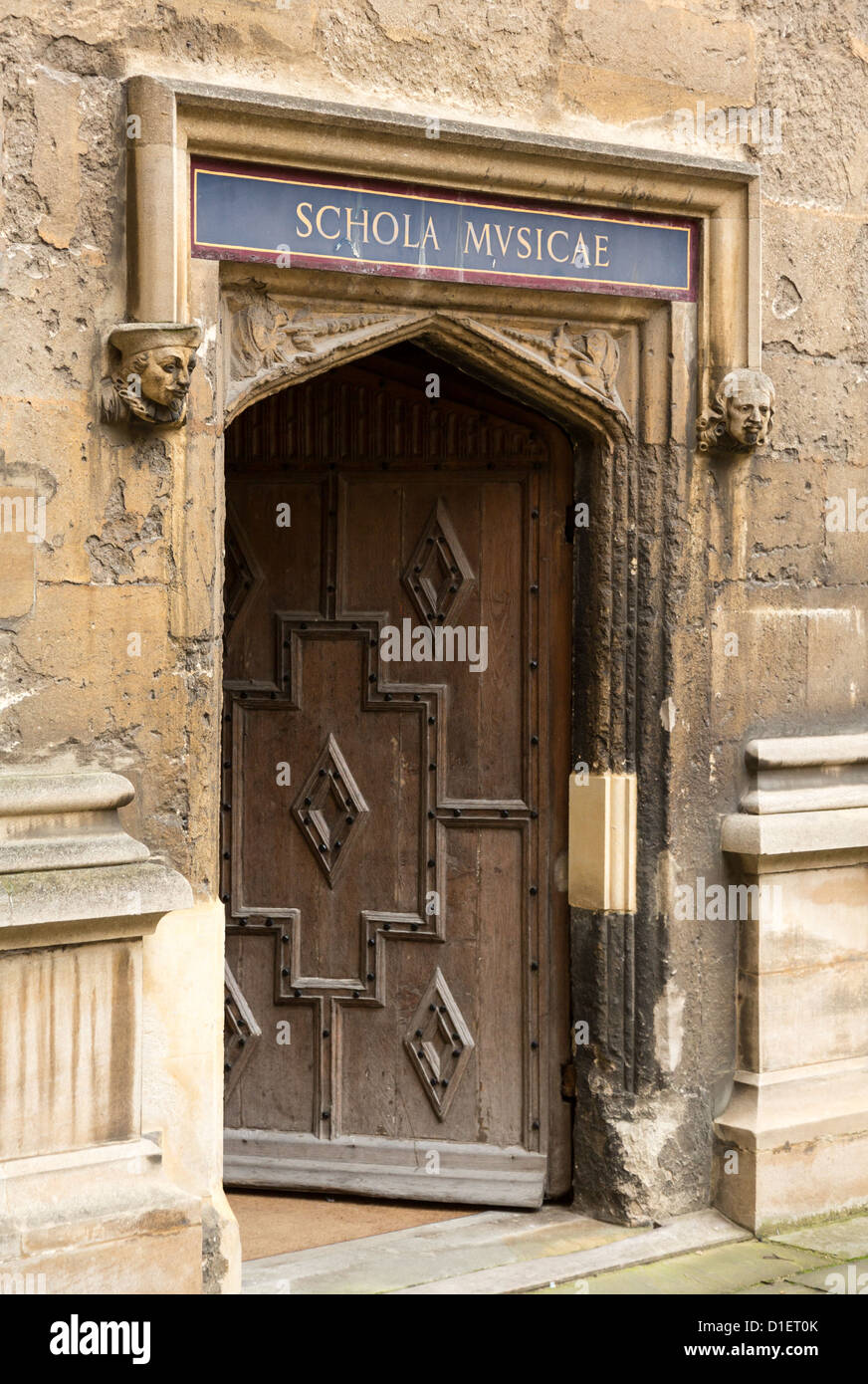 Carved wooden door at entrance to School of Music at Bodeian Library University of Oxford Stock Photo