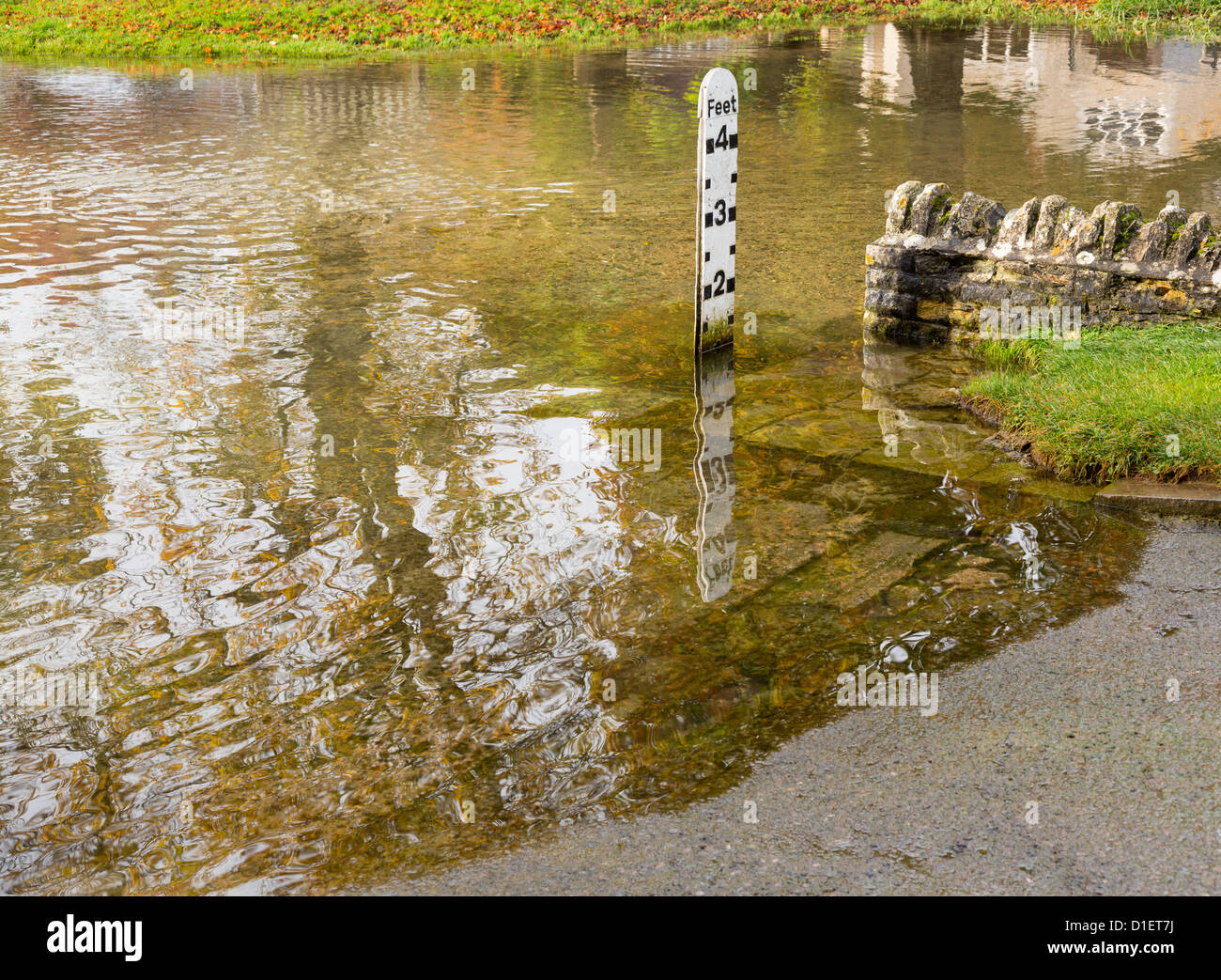 Depth gauge at deep river at road ford on Shill Brook at Shilton Oxfordshire Stock Photo