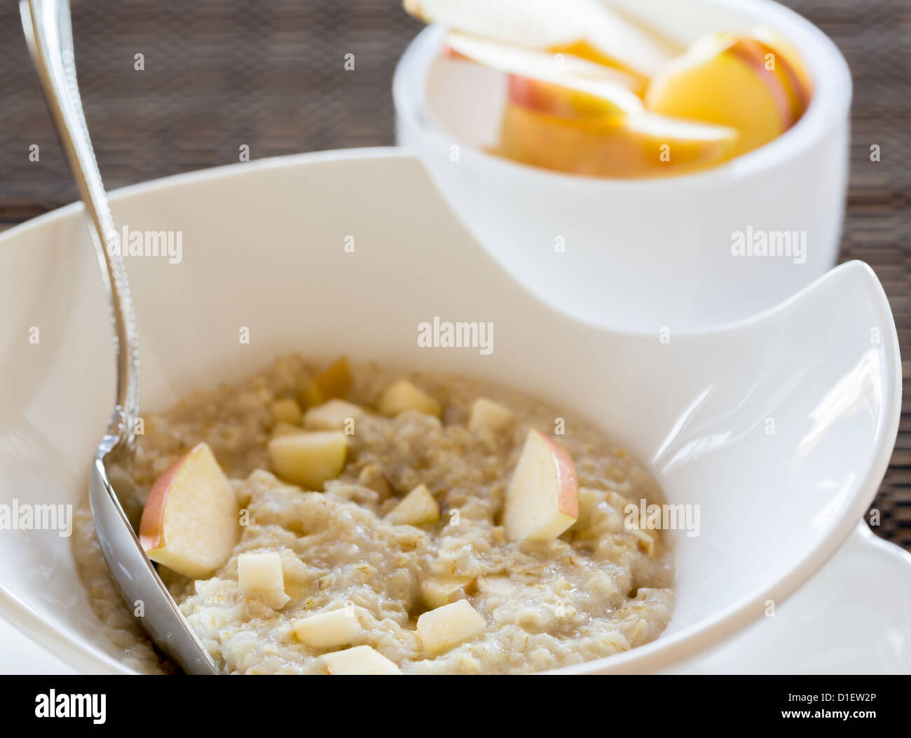 Hot oatmeal porridge or porage oats in white modern pottery bowl on ...