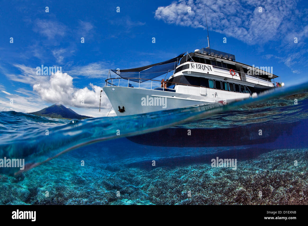 Liveaboard ship above coral reef at Father Reeds, Bismark Sea, Papua New Guinea Stock Photo